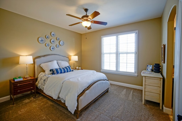 5319 Half Moon Cir, Midland, TX 79707 - carpeted bedroom featuring baseboards, multiple windows, and ceiling fan