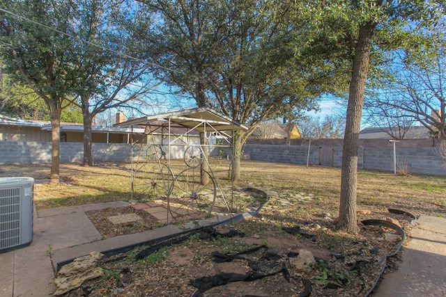 view of yard with central AC unit