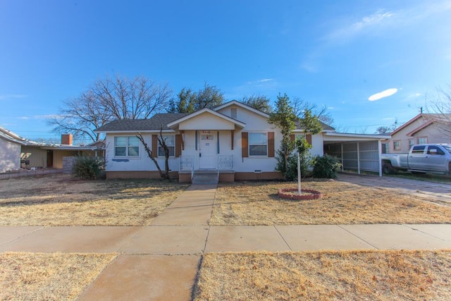 view of front of home featuring a carport