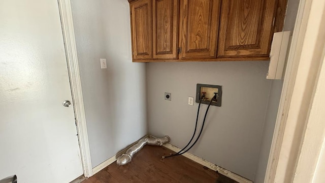 clothes washing area with dark wood-type flooring, washer hookup, cabinet space, and electric dryer hookup