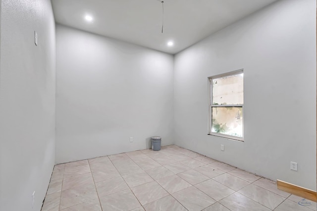 unfurnished room featuring recessed lighting