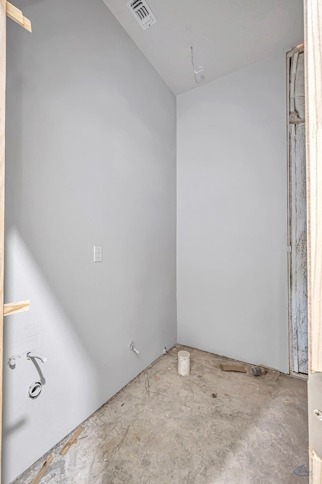 unfurnished room with visible vents and concrete floors