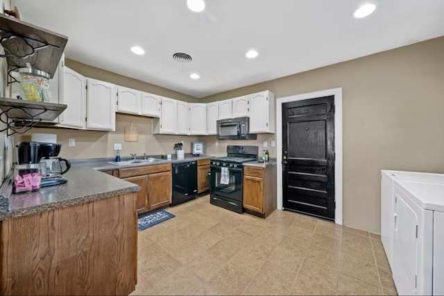 kitchen with visible vents, black appliances, white cabinetry, a sink, and recessed lighting