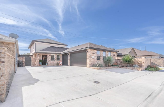 view of front of property featuring a garage and central air condition unit