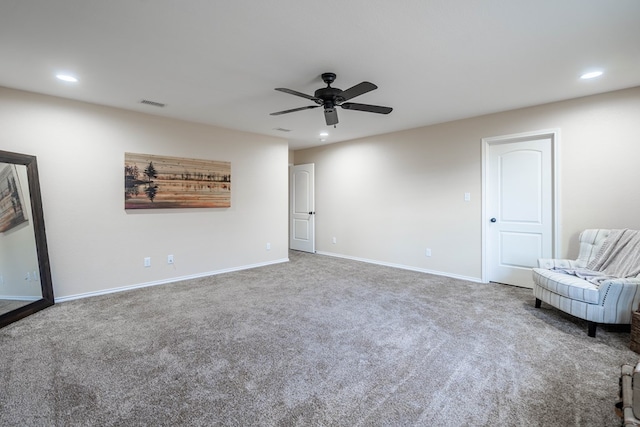 interior space with ceiling fan and carpet floors