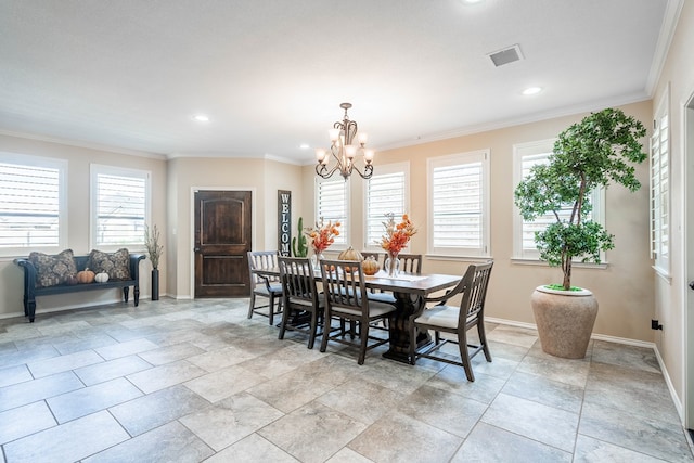 dining room with crown molding and an inviting chandelier