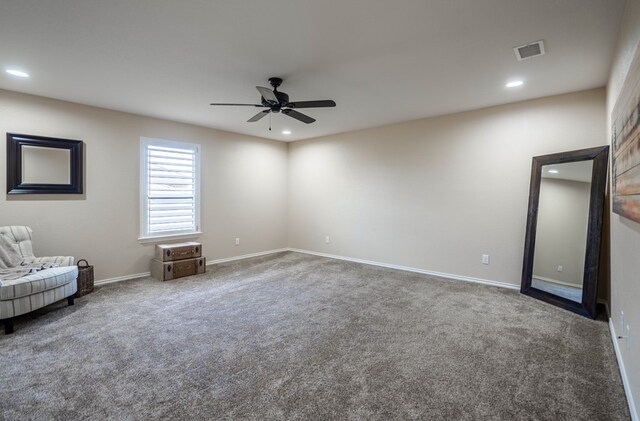 interior space featuring ceiling fan and carpet flooring