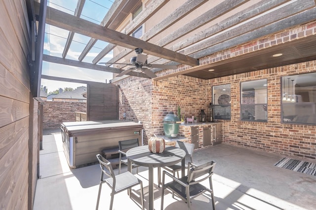 view of patio with ceiling fan, a grill, a hot tub, and a pergola