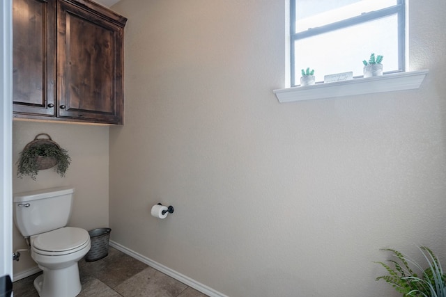 bathroom with tile patterned floors and toilet