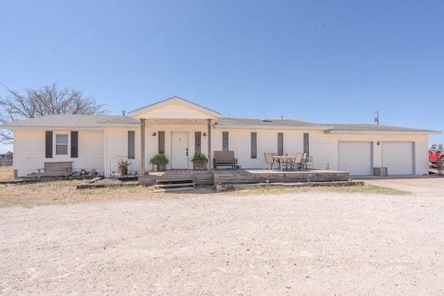 6308 S County Rd 1182, Midland, TX 79706 - view of front facade featuring driveway and an attached garage