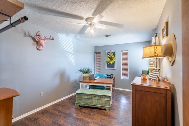 6308 S County Rd 1182, Midland, TX 79706 - office area with baseboards, visible vents, wood finished floors, and ceiling fan