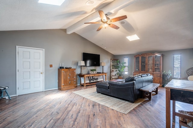 6308 S County Rd 1182, Midland, TX 79706 - living area featuring plenty of natural light, vaulted ceiling with skylight, wood finished floors, and ceiling fan