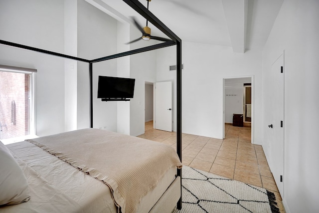 bedroom with high vaulted ceiling and light tile patterned flooring