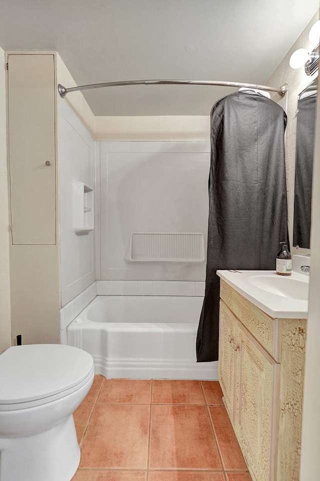 bathroom with shower / tub combo with curtain, toilet, vanity, and tile patterned floors