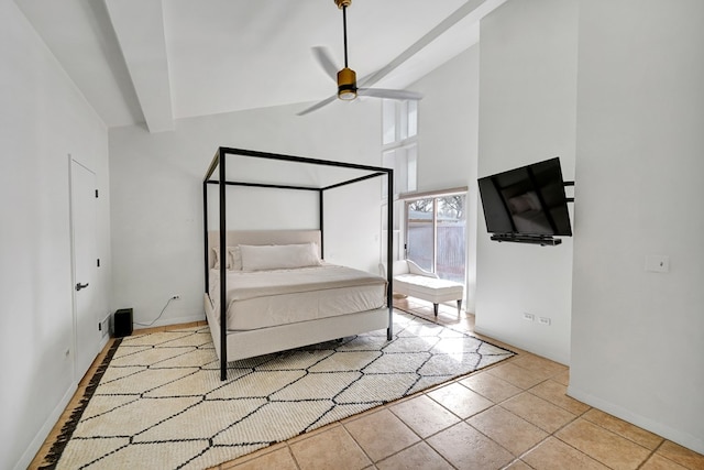 unfurnished bedroom with baseboards, ceiling fan, tile patterned floors, high vaulted ceiling, and beam ceiling