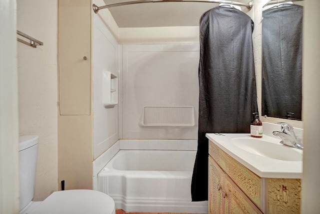 bathroom featuring shower / washtub combination, vanity, and toilet