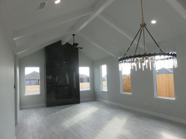 unfurnished living room with hardwood / wood-style floors, ceiling fan, and lofted ceiling