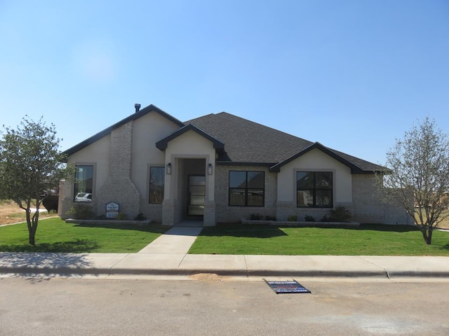 view of front facade with a front lawn