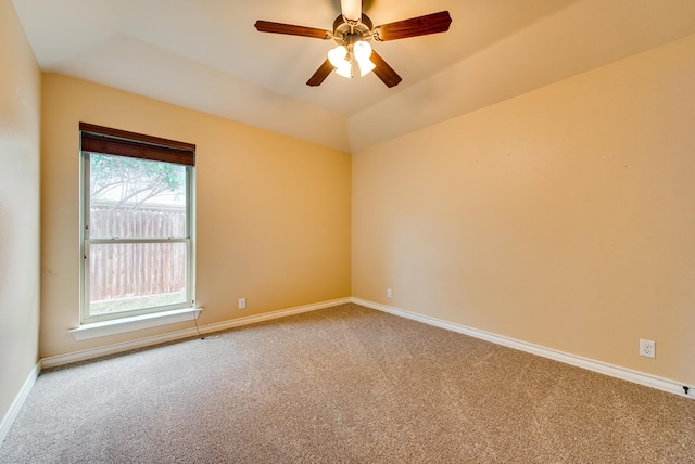 empty room featuring ceiling fan, carpet, and baseboards