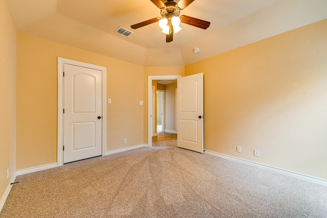 unfurnished bedroom with visible vents, ceiling fan, baseboards, and light carpet