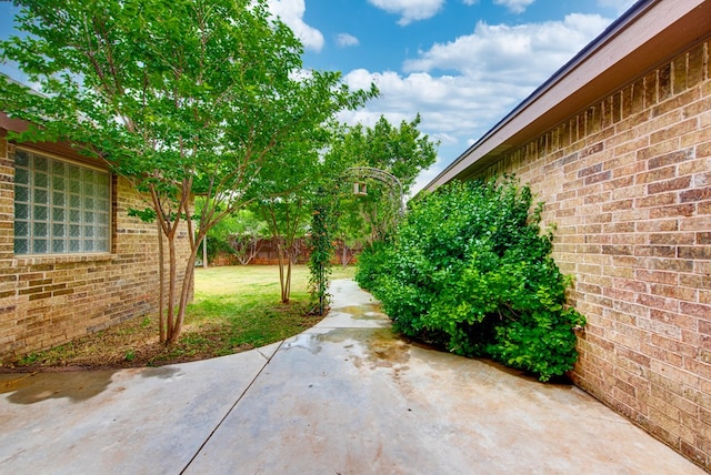 view of yard with fence and a patio area