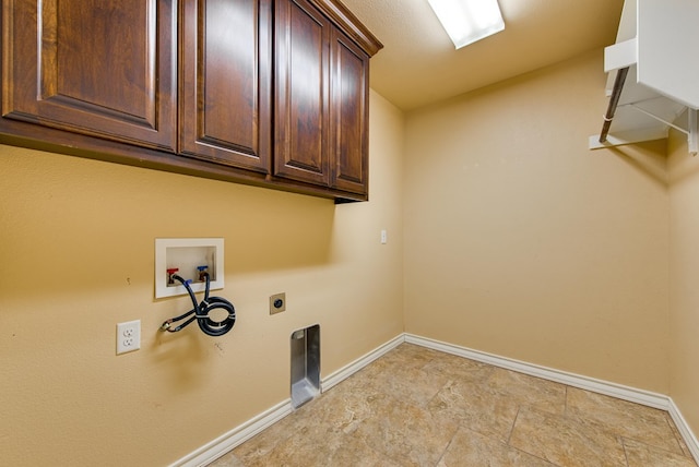 laundry area featuring hookup for an electric dryer, washer hookup, cabinet space, and baseboards