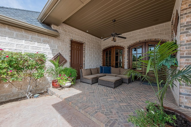 view of patio featuring french doors, a ceiling fan, and an outdoor living space