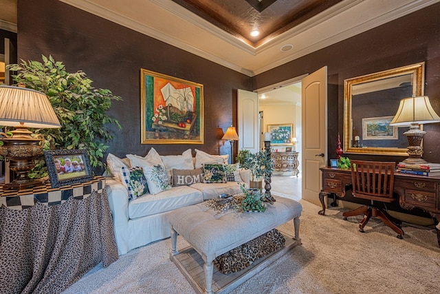carpeted living area with ornamental molding and a tray ceiling