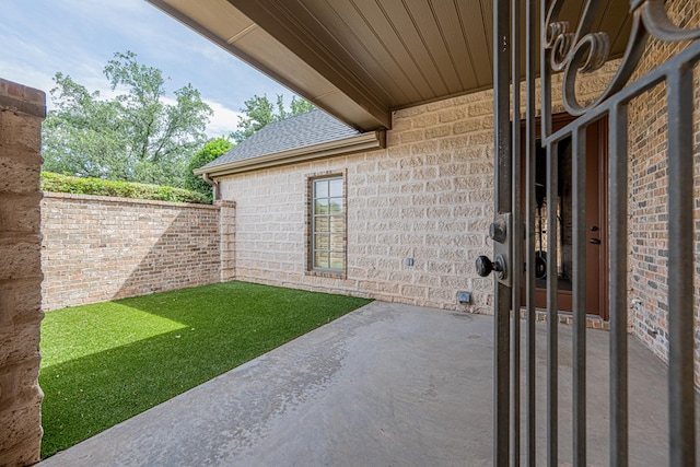 view of yard with fence and a patio