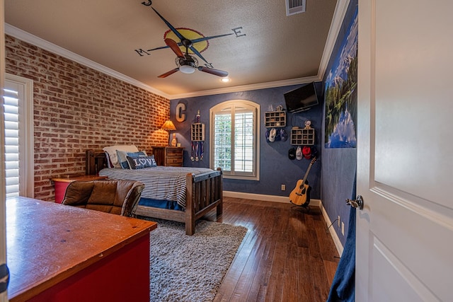 bedroom with hardwood / wood-style floors, baseboards, ornamental molding, a textured ceiling, and ceiling fan
