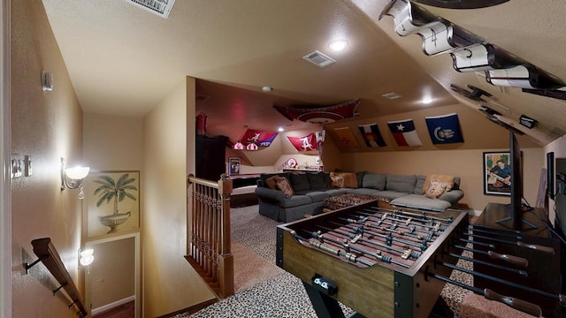 recreation room featuring carpet flooring and lofted ceiling