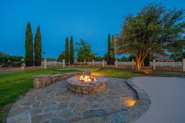 view of patio / terrace with an outdoor fire pit