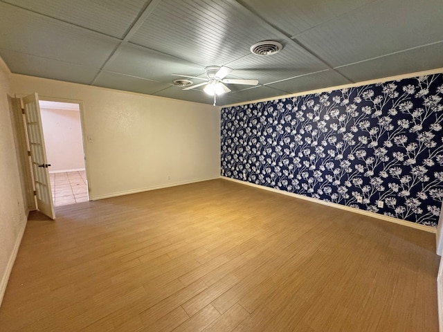 3619 W Wadley Ave, Midland, TX 79707 - empty room with wood finished floors and a ceiling fan