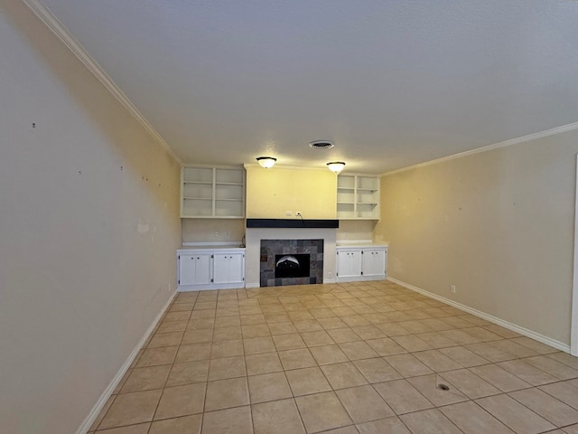 3619 W Wadley Ave, Midland, TX 79707 - unfurnished living room featuring a fireplace, crown molding, light tile patterned floors, and built in shelves