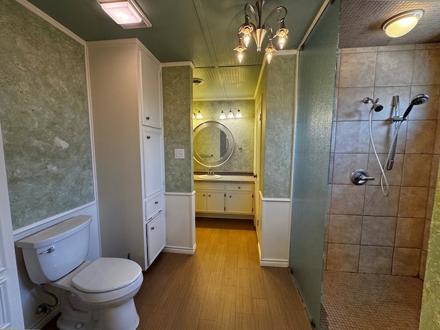 3619 W Wadley Ave, Midland, TX 79707 - full bathroom with wood finished floors, tiled shower, and vanity