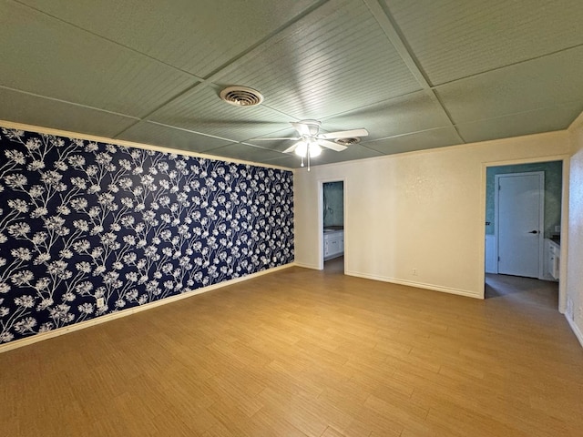3619 W Wadley Ave, Midland, TX 79707 - empty room with wood finished floors and a ceiling fan