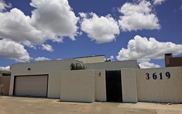 3619 W Wadley Ave, Midland, TX 79707 - adobe home with stucco siding and an attached garage