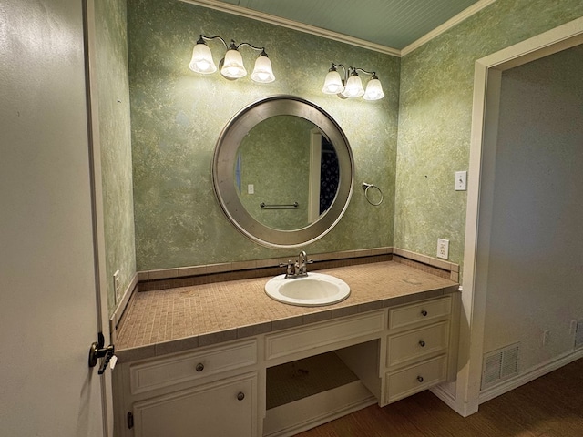 3619 W Wadley Ave, Midland, TX 79707 - bathroom featuring wood finished floors, crown molding, and vanity