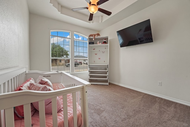 4626 Crockett Ave, Midland, TX 79703 - bedroom with a raised ceiling, ceiling fan, carpet, and baseboards