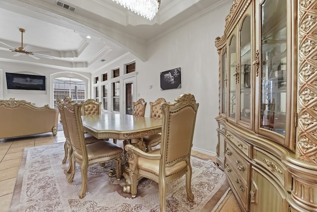 4626 Crockett Ave, Midland, TX 79703 - dining space with arched walkways, ornamental molding, ceiling fan with notable chandelier, visible vents, and light tile patterned flooring