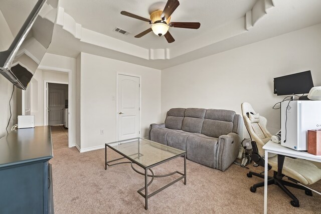 4626 Crockett Ave, Midland, TX 79703 - living room with visible vents, ceiling fan, light colored carpet, and a tray ceiling