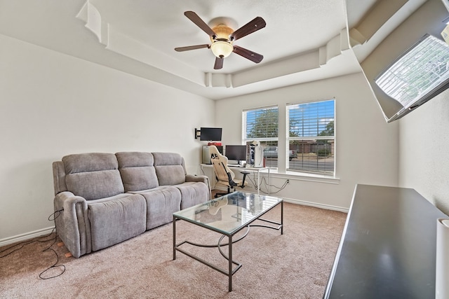 4626 Crockett Ave, Midland, TX 79703 - carpeted living area with ceiling fan, a tray ceiling, and baseboards