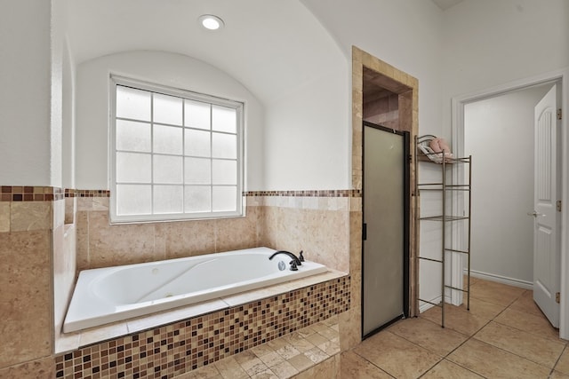 4626 Crockett Ave, Midland, TX 79703 - bathroom with tile patterned floors, a bath, and a stall shower