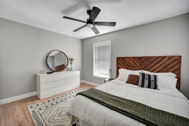1000 S Jefferson St, Midland, TX 79701 - bedroom with baseboards, light wood finished floors, and a ceiling fan