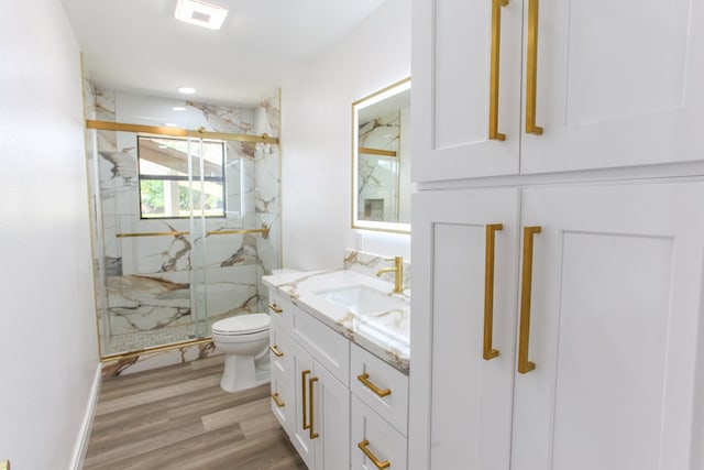 2702 Ann Dr, Big Spring, TX 79720 - full bath with vanity, a marble finish shower, and wood finished floors