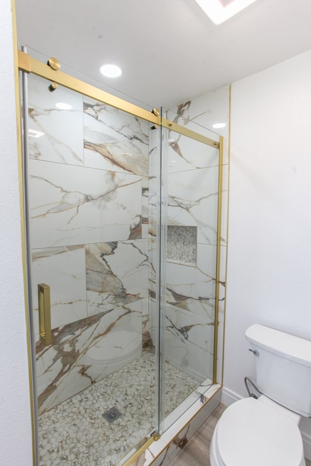2702 Ann Dr, Big Spring, TX 79720 - full bathroom with a marble finish shower, wood finished floors, and recessed lighting