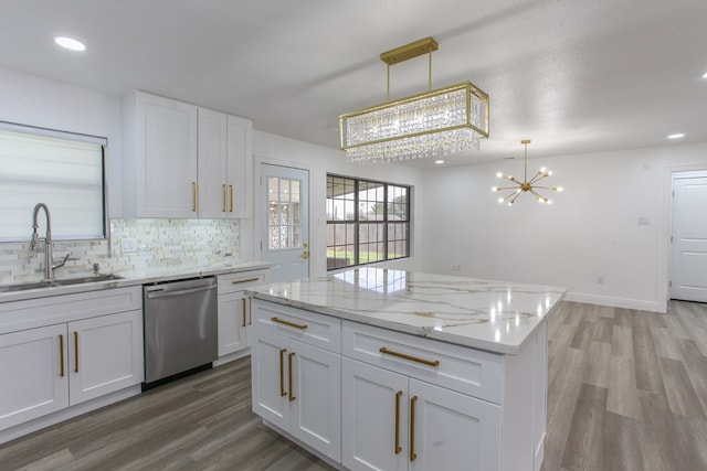 2702 Ann Dr, Big Spring, TX 79720 - kitchen featuring a chandelier, dishwasher, light wood-style flooring, decorative backsplash, and recessed lighting