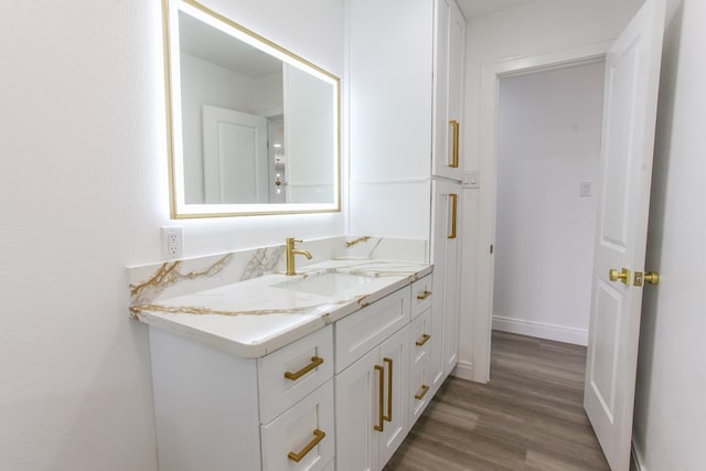 2702 Ann Dr, Big Spring, TX 79720 - bathroom featuring vanity and wood finished floors