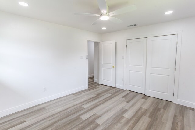 2702 Ann Dr, Big Spring, TX 79720 - unfurnished bedroom with light wood finished floors, recessed lighting, a closet, and ceiling fan