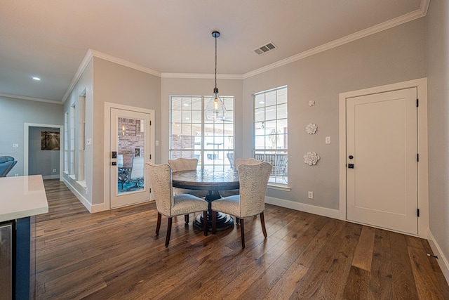 dining area with ornamental molding, visible vents, dark wood finished floors, and baseboards